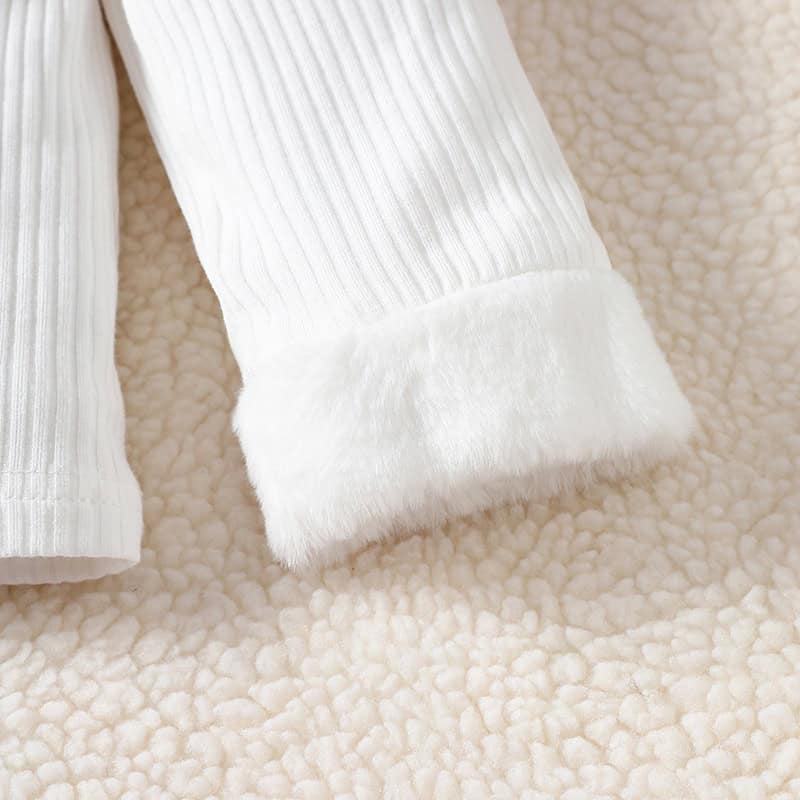 Luxurious white cashmere sleeve with fur cuff on soft cream textured background, emphasizing comfort and elegance in fashion and style.