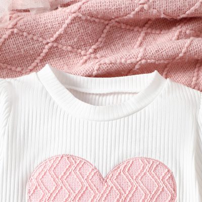 Pink quilted heart patch on white ribbed T-shirt, casual fashion kids clothing. Soft cotton material, trendy design, perfect for baby girls and toddlers. Monalisa Store opt.