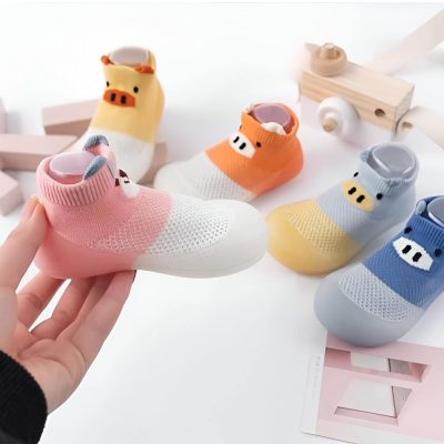 Colorful pig-themed designer sneakers with breathable mesh fabric for kids, featuring playful pig face embellishments, perfect for children's fashion and comfort.