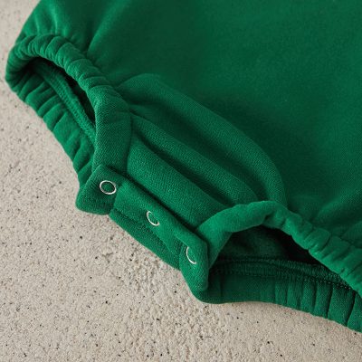 Elastic waistband green athletic shorts close-up, casual sportswear for men and women, comfortable high-quality fabric, versatile activewear for gym and running activities, Monalisa Medical store.