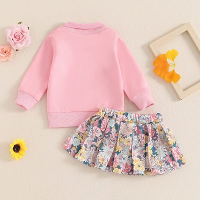 Bright pink children's sweatshirt with floral skirt set, perfect for kids' fashion and spring wear. Stylish and comfortable clothing for girls, ideal for casual outings and everyday wear.