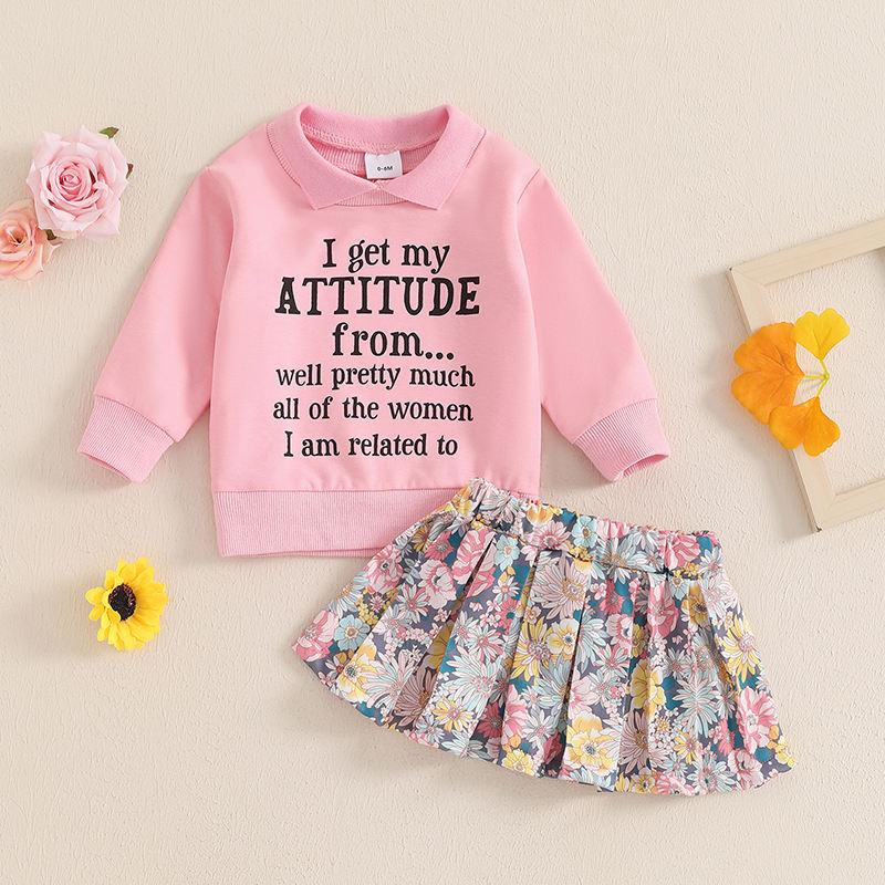 Pink children's sweatshirt with motivational quote and a colorful floral skirt, perfect for casual kids' fashion and comfortable wear.