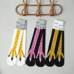 Brightly colored socks featuring cheerful giraffe patterns, perfect for kids or fun, casual wear. Durable, comfortable, and playful design ideal for everyday use or gift-giving.