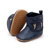 Soft navy blue baby shoes with tan suede accents, flexible rubber sole, and comfortable design for infants, ideal for early walking and stylish everyday wear.