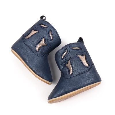 Stylish navy blue leather children's shoes with cut-out design, perfect for toddlers and early walkers, combining comfort and fashion.
