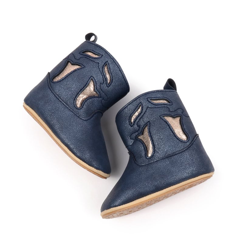 Stylish navy blue leather children's shoes with cut-out design, perfect for toddlers and early walkers, combining comfort and fashion.