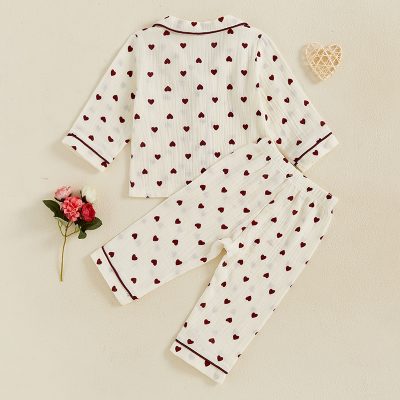 Soft white pajama set with red heart patterns, perfect for comfy nights and relaxed sleep. Stylish and cozy sleepwear for women from Monalisa Store, designed for comfort and elegance.
