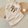 Soft beige toddler sweatshirt and pants set with a bow design, perfect for children’s casual and comfortable wear, from Monalisa Store.