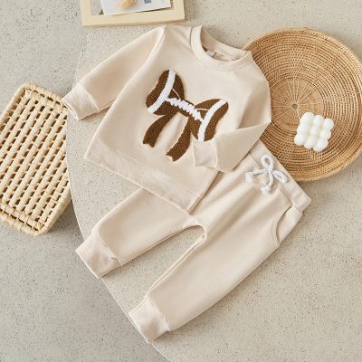 Soft beige toddler sweatshirt and pants set with a bow design, perfect for children’s casual and comfortable wear, from Monalisa Store.