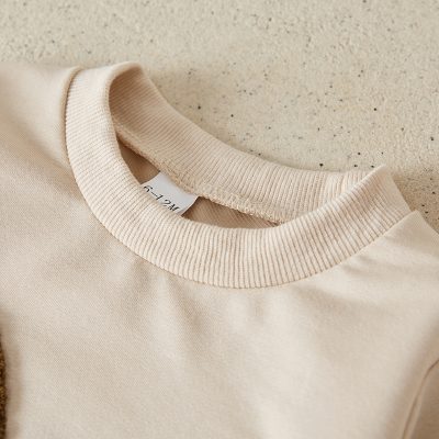 Soft beige sweatshirt with ribbed collar, casual apparel ideal for comfortable fashion, available at Monalisa Store.