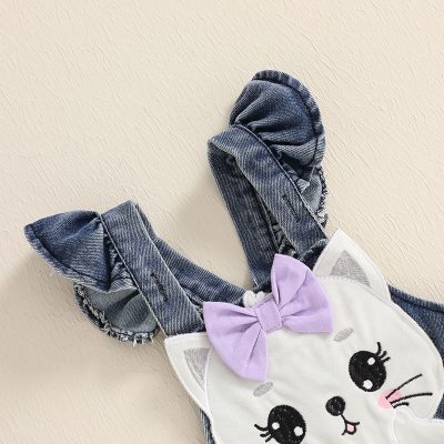 Soft denim bunny ears headband with embroidered animal face, pink blush, and lavender bow, perfect for children's accessories and cute animal-themed fashion.