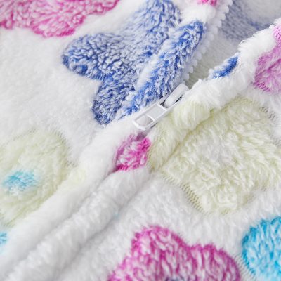 Soft, colorful plush fleece blanket with heart patterns, featuring a zipper and vibrant pastel shades ideal for cozy comfort and aesthetic home decor.