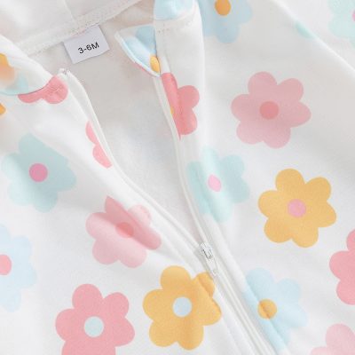 Bright floral-patterned baby raincoat featuring pastel pink, blue, and yellow flowers with a white zipper, perfect for 3-6 months infants, combining adorable design with waterproof protection.
