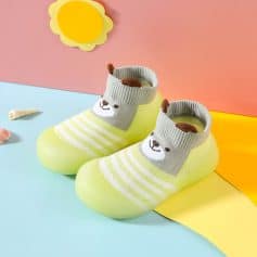 Soft baby socks with bear face design, ideal for infant footwear, featuring comfortable knit material and non-slip soles, perfect for early walkers.