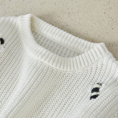 Knitted white sweater with distressed details, casual fashionwear, cozy winter clothing, Monalisa Store for trendy and affordable clothing options in the United States.
