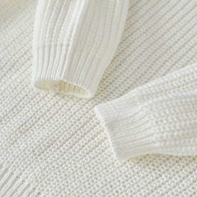 Soft white knitted sweater with ribbed cuffs, cozy and stylish clothing from Monalisa Store, ideal for fashion and comfort, perfect for winter or casual wear.