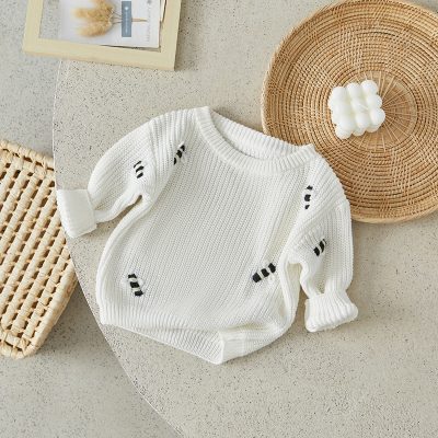 Soft white knit sweater with black stripe accents, cozy and stylish, perfect for fall and winter fashion, available at Monalisa Store for trendy women's clothing.