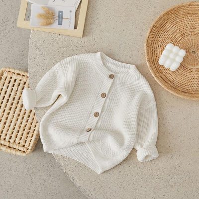 Knitted white baby cardigan, cozy infant clothing, Monalisa Store organic baby fashion, soft cotton newborn sweater for boys and girls, stylish babywear for winter and spring seasons, premium quality baby knitwear.