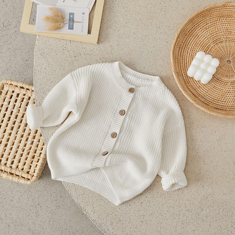 Knitted white baby cardigan, cozy infant clothing, Monalisa Store organic baby fashion, soft cotton newborn sweater for boys and girls, stylish babywear for winter and spring seasons, premium quality baby knitwear.