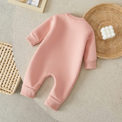Soft pink baby romper with long sleeves and comfy cuffs, perfect for newborns and infants. Ideal for everyday wear and special occasions.