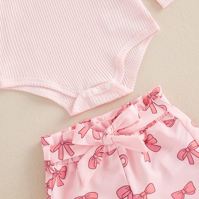 Pink baby onesie with snap buttons and pink bow-printed shorts set, soft cotton infant clothing for girls, comfortable and stylish newborn apparel, perfect for baby showers and everyday wear.