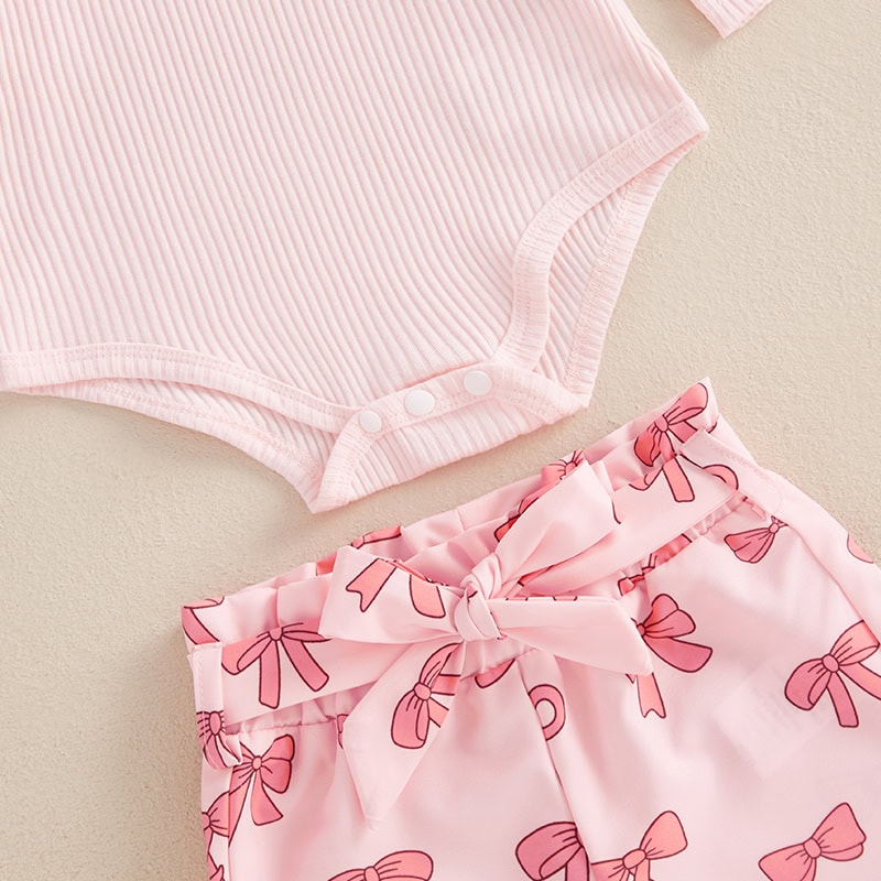 Pink baby onesie with snap buttons and pink bow-printed shorts set, soft cotton infant clothing for girls, comfortable and stylish newborn apparel, perfect for baby showers and everyday wear.