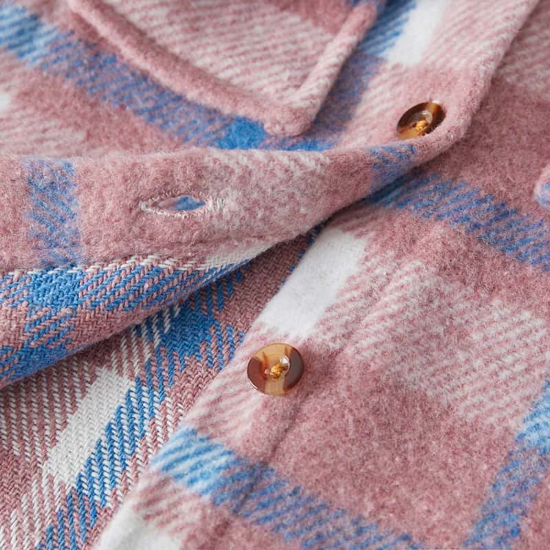 Soft pink plaid wool shirt with tortoiseshell buttons, perfect for fall fashion and outdoor wear, showcasing quality craftsmanship.