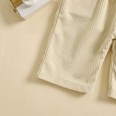 Soft beige ribbed sweater perfect for fall and winter, available at Monalisa Store's fashion collection. Comfortable and stylish for everyday wear.