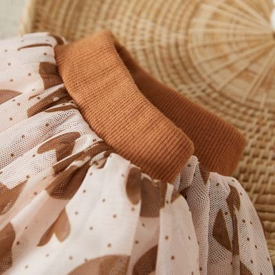 Soft beige and white patterned baby clothing with a comfortable knit collar, perfect for newborns and infants, available at Monalisa Store for stylish baby fashion.