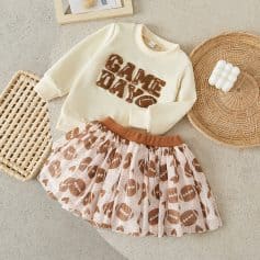 Cute kids sweatshirt and skirt set with football theme, perfect for sporty children’s fashion, stylish casual wear for girls, trendy sports-inspired clothing for kids.