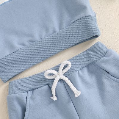 Comfortable light blue hoodie and sweatpants set, perfect for casual wear, active lifestyles, or loungewear, featuring a drawstring waist and ribbed cuffs.