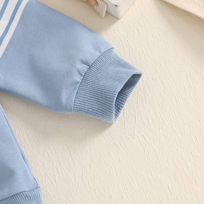 Soft blue sweatshirt sleeve with ribbed cuff, close-up image emphasizing comfortable casual clothing, ideal for showcasing trendy and cozy apparel options at Monalisa Store.