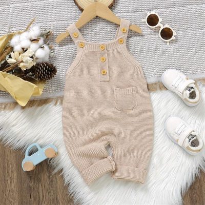 Soft beige knitted baby romper with wooden buttons, small pocket, and shoulder straps, perfect for infants to wholesale and retail at Monalisa Medical Store.
