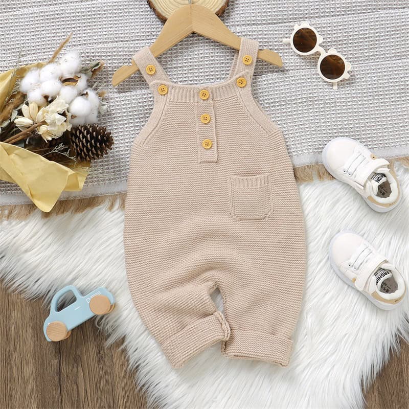 Soft beige baby romper with button details, shoulder straps, and front pocket, perfect for infant fashion and comfortable wear from Monalisa Medical Store.