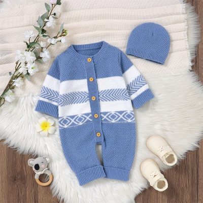 Soft blue and white knit baby romper and beanie set with geometric patterns, wooden buttons, and cozy textures, perfect for cold weather and stylish baby outfits.