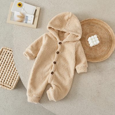 Soft beige baby fleece jumpsuit with hood and button closure, perfect for newborns and infants, ideal for cozy winter or fall wear.