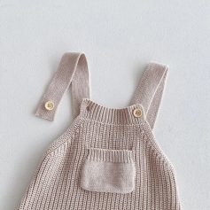 Soft beige knitted baby overalls with button straps and front pocket, ideal for comfortable children's fashion and accessories at Monalisa Store in opt.