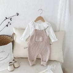 Comfortable baby clothing set featuring a white lace-collared top and beige knitted overalls, ideal for infant fashion, cozy and stylish for everyday wear.