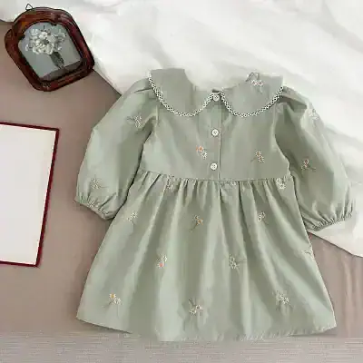 Flower embroidered girls dress with peter pan collar and puffed sleeves, perfect for special occasions.
