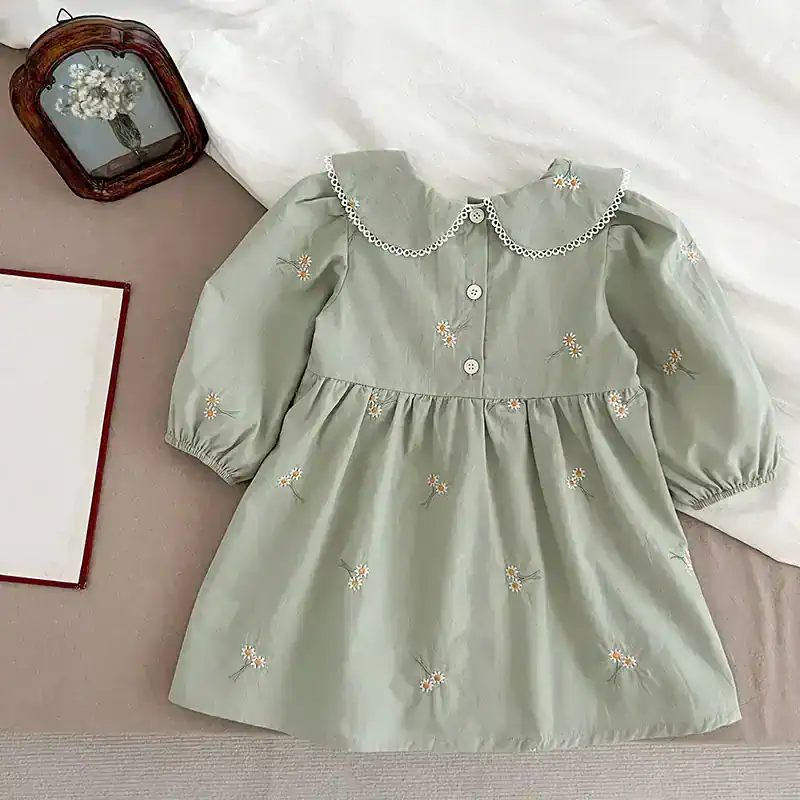 Flower embroidered girls dress with peter pan collar and puffed sleeves, perfect for special occasions.