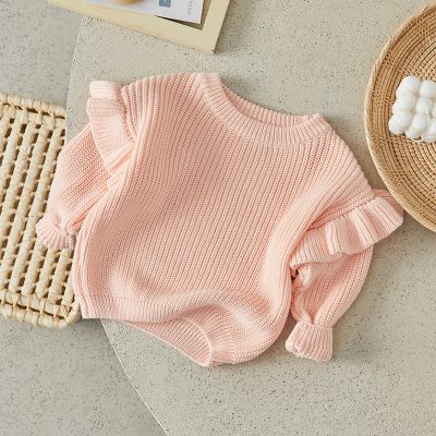 Soft pink knit sweater with ruffle sleeves, cozy and stylish women's fashion, perfect for casual wear and layering, featured on Monalisa Store.