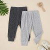Comfy ribbed knit baby leggings in gray and black, perfect for kids’ casual wear and outdoor activities.