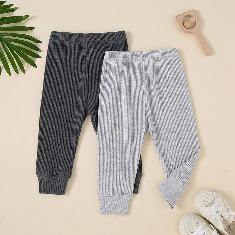 Comfy ribbed knit baby leggings in gray and black, perfect for kids’ casual wear and outdoor activities.