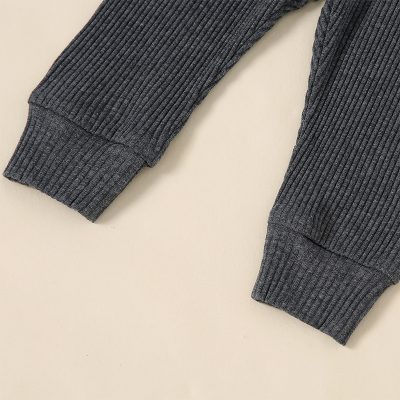 Soft gray ribbed fabric cuffs from a stylish sweater, perfect for cold weather and fashion-forward comfort. Ideal for casual or layered looks in the Monalisa Store collection.