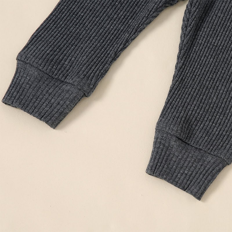 Soft gray ribbed fabric cuffs from a stylish sweater, perfect for cold weather and fashion-forward comfort. Ideal for casual or layered looks in the Monalisa Store collection.