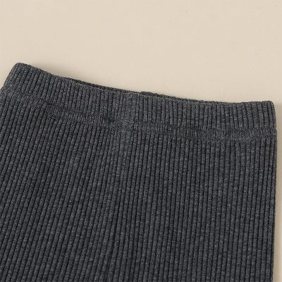 Dark gray ribbed knit fabric for clothing or accessories, close-up view, high quality textile material.