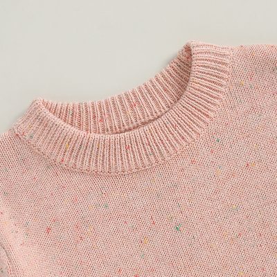 Pink speckled knit sweater with ribbed crew neckline, perfect for optical comfort and stylish eyewear shopping at Monalisa Store in Dubai.