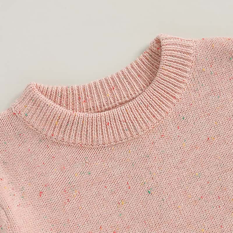 Pink speckled knit sweater with ribbed crew neckline, perfect for optical comfort and stylish eyewear shopping at Monalisa Store in Dubai.