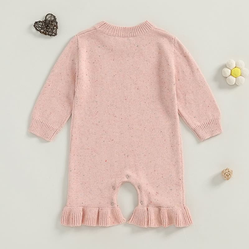 Soft pink baby knit romper with ruffled hem, ideal for infants, perfect for stylish and comfortable baby wear.