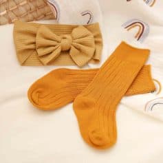 Soft mustard yellow ribbed socks and matching headband with a bow on a cozy white background. Perfect for stylish, comfortable women's fashion accessories at Monalisa Store.